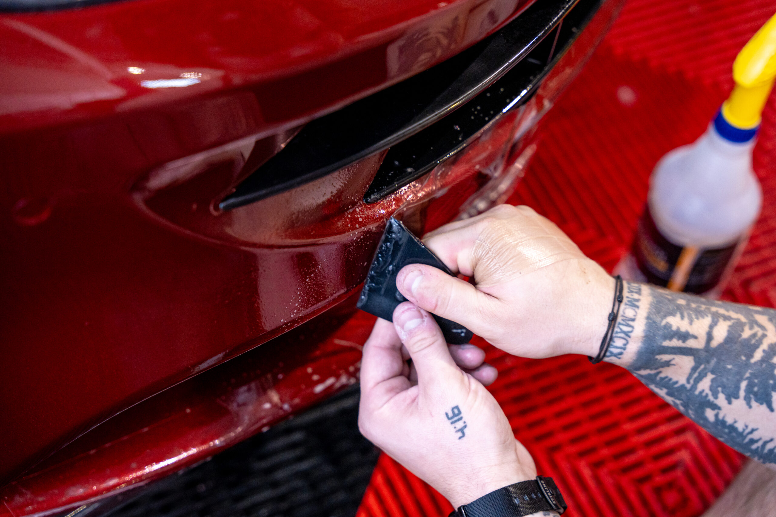 Applying XPEL Ultimate Plus PPF to The Front Bumper of The Ferrari FF