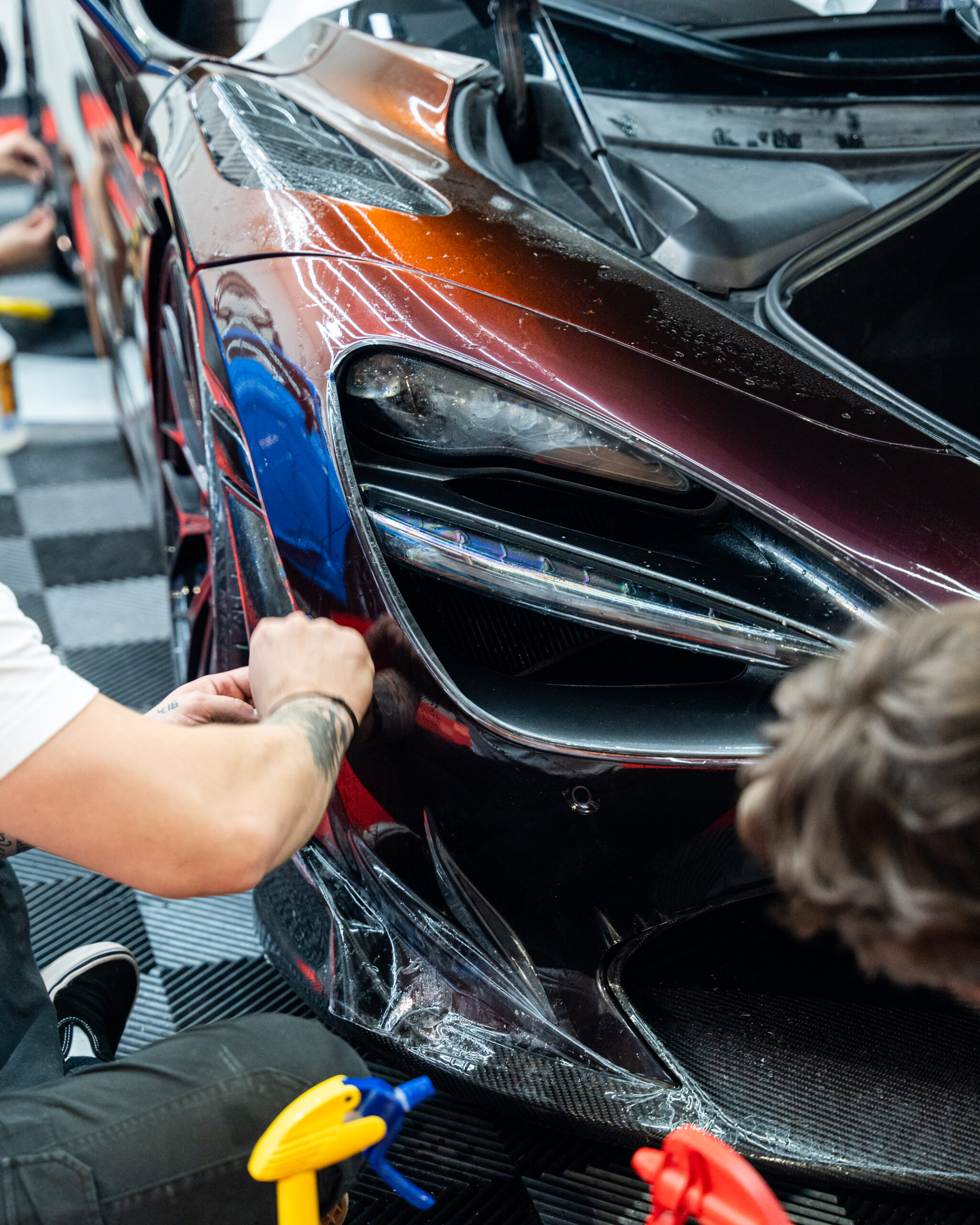 Xpel Ultimate Plus PPF being applied to the front end of this Mclaren 720s