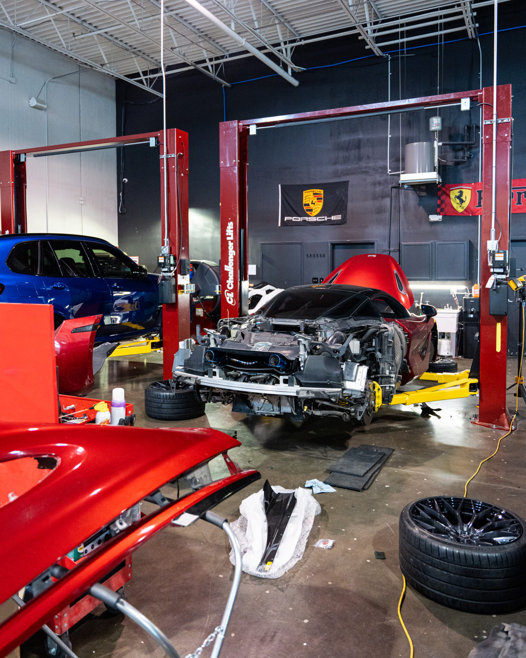 The Mclaren 720s disassembled, with bumpers and quarter panels resting on panel stands