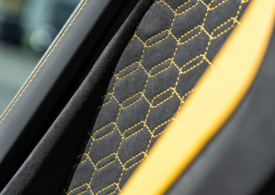 Lamborghini's hexagonal stitch pattern on the door card of the Revuelto