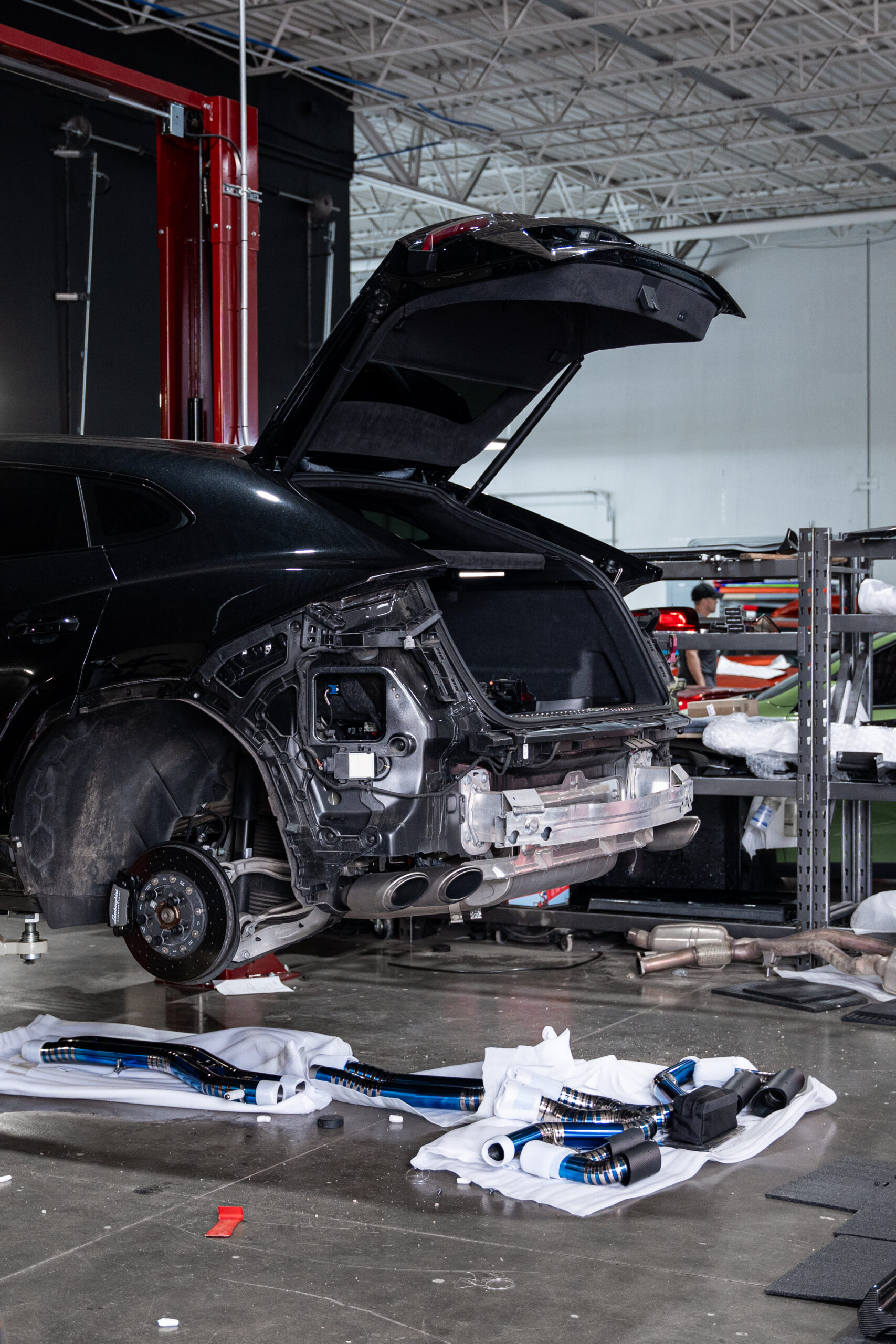 To install the rear diffuser which is the whole lower half of the rear bumper, the bumper had to be removed in order to remove the lower half of the factory bumper