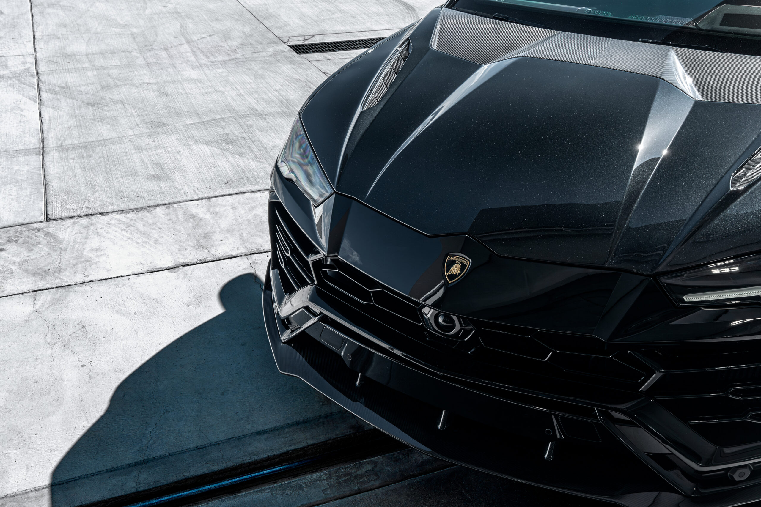 Closeup of the Ryft hood and front splitter on the completed Lamborghini Urus