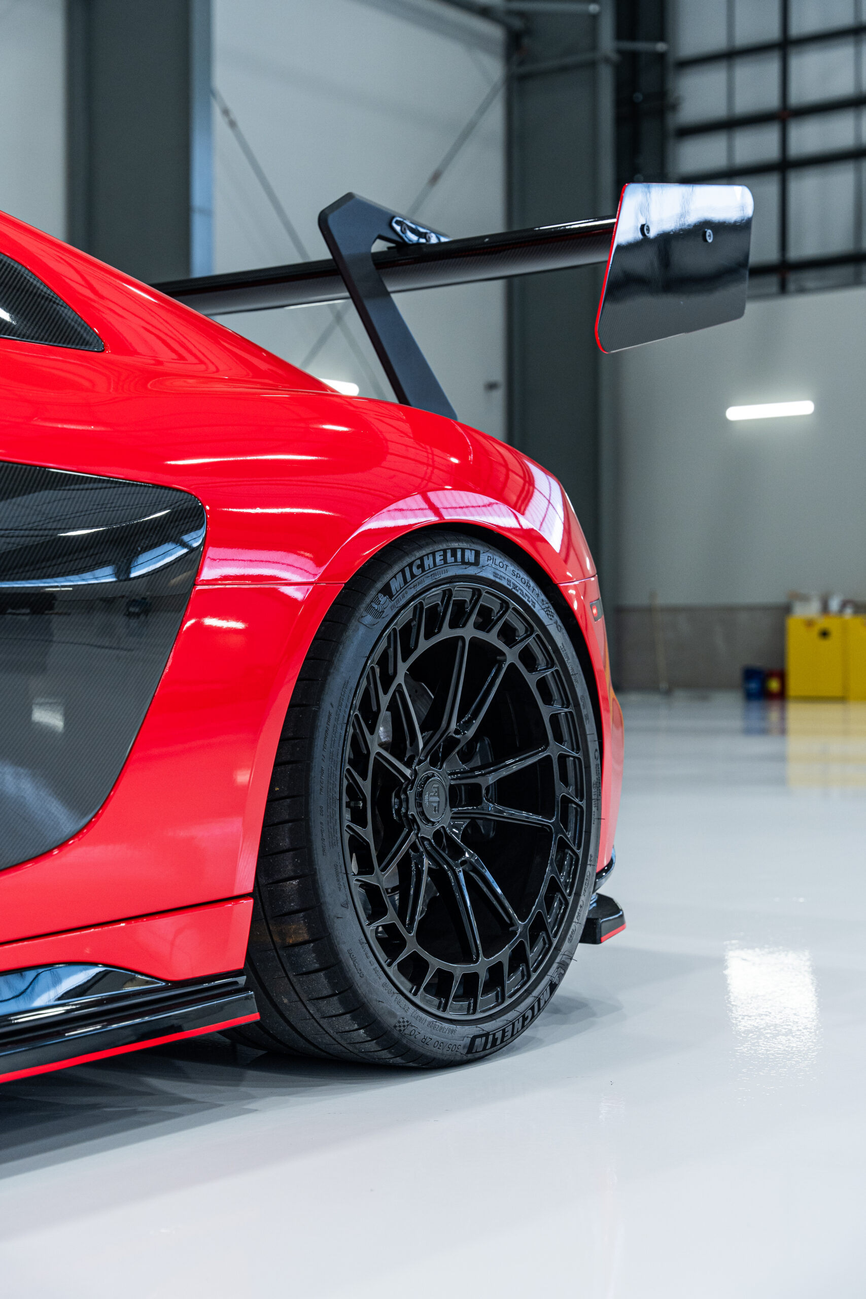 Jordan installing the Ford Racing tribute doorjambs on the Liquid Carbon Ford GT